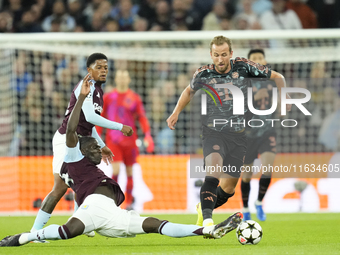 Harry Kane centre-forward of Bayern Munich and England and Amadou Onana defensive midfield of Aston Villa and Belgium compete for the ball d...