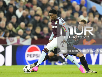 Jaden Philogene left winger of Aston Villa and England and Joshua Kimmich central midfield of Bayern Munich and Germany compete for the ball...