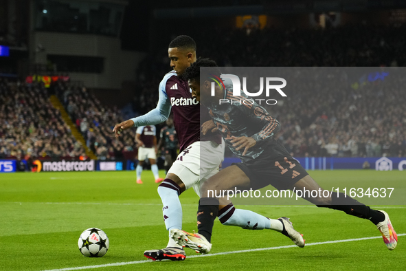 Kingsley Coman left winger of Bayern Munich and France and Ezri Konsa centre-back of Aston Villa and England compete for the ball during the...