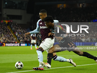 Kingsley Coman left winger of Bayern Munich and France and Ezri Konsa centre-back of Aston Villa and England compete for the ball during the...