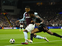 Kingsley Coman left winger of Bayern Munich and France and Ezri Konsa centre-back of Aston Villa and England compete for the ball during the...