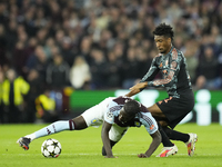 Amadou Onana defensive midfield of Aston Villa and Belgium and Kingsley Coman left winger of Bayern Munich and France compete for the ball d...