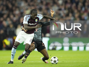 Amadou Onana defensive midfield of Aston Villa and Belgium and Kingsley Coman left winger of Bayern Munich and France compete for the ball d...