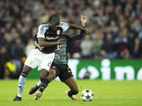 Amadou Onana defensive midfield of Aston Villa and Belgium and Kingsley Coman left winger of Bayern Munich and France compete for the ball d...