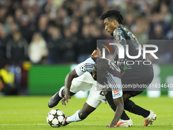 Amadou Onana defensive midfield of Aston Villa and Belgium and Kingsley Coman left winger of Bayern Munich and France compete for the ball d...