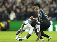 Amadou Onana defensive midfield of Aston Villa and Belgium and Kingsley Coman left winger of Bayern Munich and France compete for the ball d...