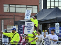 Longshoremen carry placards and demonstrate in front of the Red Hook terminal in Brooklyn, New York, U.S., on October 3, 2024. Longshoremen...