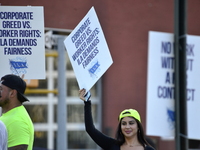 Longshoremen carry placards and demonstrate in front of the Red Hook terminal in Brooklyn, New York, U.S., on October 3, 2024. Longshoremen...