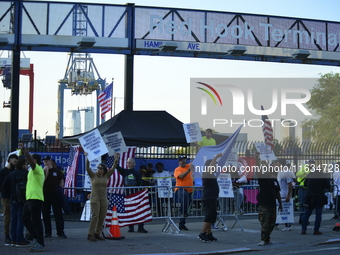 Longshoremen carry placards and demonstrate in front of the Red Hook terminal in Brooklyn, New York, U.S., on October 3, 2024. Longshoremen...