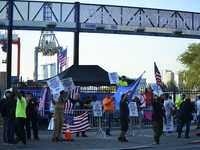 Longshoremen carry placards and demonstrate in front of the Red Hook terminal in Brooklyn, New York, U.S., on October 3, 2024. Longshoremen...