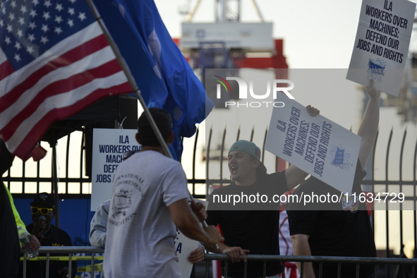 Longshoremen carry placards and demonstrate in front of the Red Hook terminal in Brooklyn, New York, U.S., on October 3, 2024. Longshoremen...