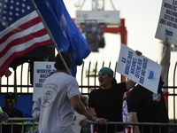 Longshoremen carry placards and demonstrate in front of the Red Hook terminal in Brooklyn, New York, U.S., on October 3, 2024. Longshoremen...