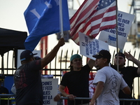 Longshoremen carry placards and demonstrate in front of the Red Hook terminal in Brooklyn, New York, U.S., on October 3, 2024. Longshoremen...