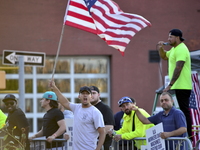 Longshoremen carry placards and demonstrate in front of the Red Hook terminal in Brooklyn, New York, U.S., on October 3, 2024. Longshoremen...