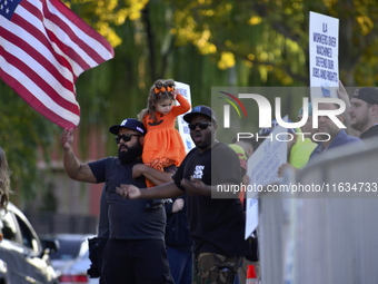 Longshoremen carry placards and demonstrate in front of the Red Hook terminal in Brooklyn, New York, U.S., on October 3, 2024. Longshoremen...