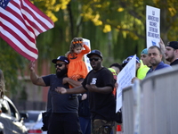 Longshoremen carry placards and demonstrate in front of the Red Hook terminal in Brooklyn, New York, U.S., on October 3, 2024. Longshoremen...