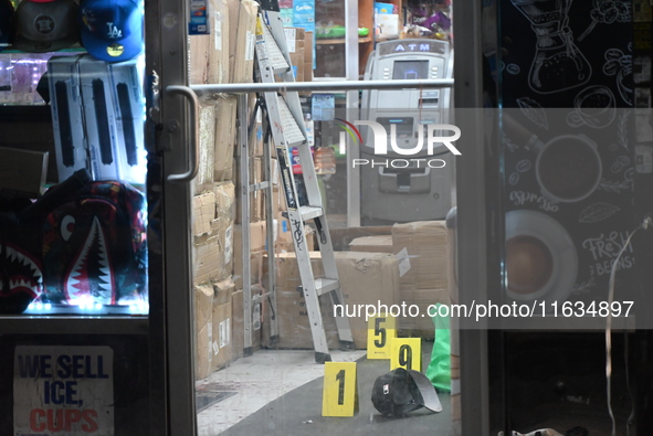 Crime scene investigators from the NYPD place evidence markers and search for clues at the scene where a 29-year-old woman is fatally stabbe...