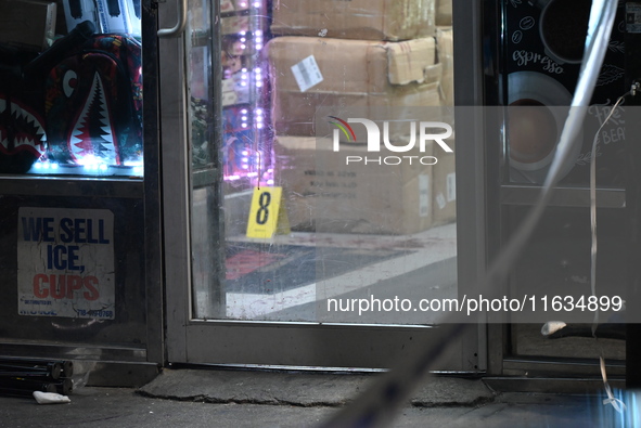 Crime scene investigators from the NYPD place evidence markers and search for clues at the scene where a 29-year-old woman is fatally stabbe...