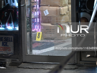 Crime scene investigators from the NYPD place evidence markers and search for clues at the scene where a 29-year-old woman is fatally stabbe...