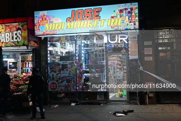 Crime scene investigators from the NYPD place evidence markers and search for clues at the scene where a 29-year-old woman is fatally stabbe...