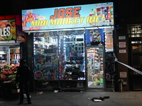 Crime scene investigators from the NYPD place evidence markers and search for clues at the scene where a 29-year-old woman is fatally stabbe...