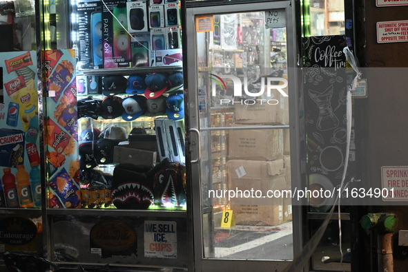 Crime scene investigators from the NYPD place evidence markers and search for clues at the scene where a 29-year-old woman is fatally stabbe...