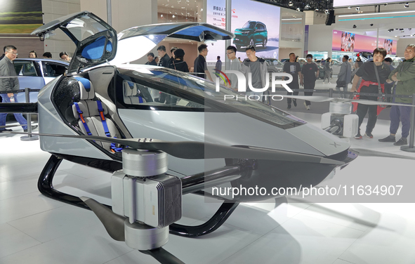 Visitors look at the XPENG AEROHT ''Traveler X2'' electric flying aircraft at the 2024 China (Tianjin) International Auto Show in Tianjin, C...