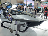 Visitors look at the XPENG AEROHT ''Traveler X2'' electric flying aircraft at the 2024 China (Tianjin) International Auto Show in Tianjin, C...