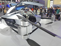 Visitors look at the XPENG AEROHT ''Traveler X2'' electric flying aircraft at the 2024 China (Tianjin) International Auto Show in Tianjin, C...