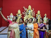 In Jaipur, Rajasthan, India, on October 3, 2024, women take a selfie as they participate in the unveiling ceremony of the rare Mahishasur Ma...