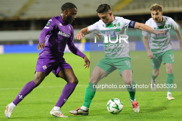 Jonathan Ikonè of ACF Fiorentina and Daniel Redmond of The New Saints ,battle for the ball during the Conference League match between ACF Fi...