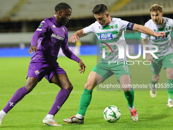 Jonathan Ikonè of ACF Fiorentina and Daniel Redmond of The New Saints ,battle for the ball during the Conference League match between ACF Fi...