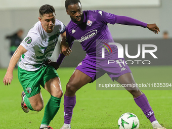 Jonathan Ikonè of ACF Fiorentina and Daniel Redmond of The New Saints ,battle for the ball during the Conference League match between ACF Fi...