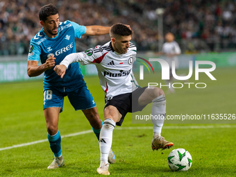 Pablo Fornalks and Ruben Vinagre are playing during UEFA Conference League match between Legia Warsaw and Real Betis in Warsaw Poland on 3 O...