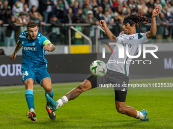 Aitor Ruibal and Maximillian Oyedele  are playing during UEFA Conference League match between Legia Warsaw and Real Betis in Warsaw Poland o...