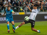 Aitor Ruibal and Maximillian Oyedele  are playing during UEFA Conference League match between Legia Warsaw and Real Betis in Warsaw Poland o...