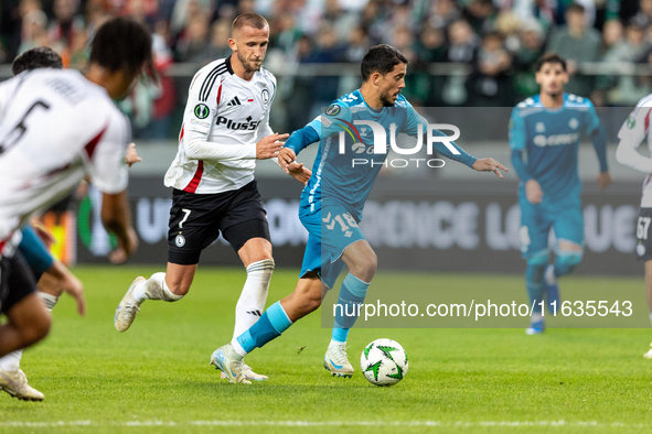 Tomas Pekhart and Pablo Fornals  are playing during UEFA Conference League match between Legia Warsaw and Real Betis in Warsaw Poland on 3 O...