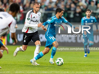 Tomas Pekhart and Pablo Fornals  are playing during UEFA Conference League match between Legia Warsaw and Real Betis in Warsaw Poland on 3 O...