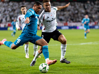 Vitor Roque and Steve Kapuadi  are playing during UEFA Conference League match between Legia Warsaw and Real Betis in Warsaw Poland on 3 Oct...