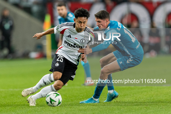 Ryoya Morishita and Sergi Altimira  are playing during UEFA Conference League match between Legia Warsaw and Real Betis in Warsaw Poland on...