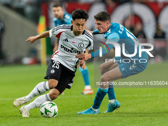 Ryoya Morishita and Sergi Altimira  are playing during UEFA Conference League match between Legia Warsaw and Real Betis in Warsaw Poland on...