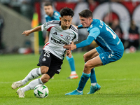 Ryoya Morishita and Sergi Altimira  are playing during UEFA Conference League match between Legia Warsaw and Real Betis in Warsaw Poland on...