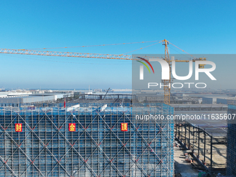 Workers work at the construction site of a standardized factory in Sihong Economic Development Zone in Suqian, Jiangsu province, China, on O...