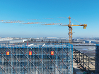 Workers work at the construction site of a standardized factory in Sihong Economic Development Zone in Suqian, Jiangsu province, China, on O...