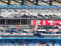 Workers work at the construction site of a standardized factory in Sihong Economic Development Zone in Suqian, Jiangsu province, China, on O...