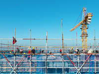 Workers work at the construction site of a standardized factory in Sihong Economic Development Zone in Suqian, Jiangsu province, China, on O...