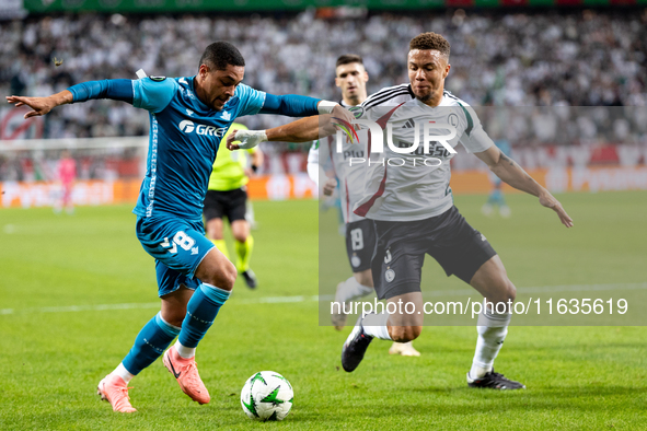 Vitor Roque and  Steve Kapuadi  are playing during UEFA Conference League match between Legia Warsaw and Real Betis in Warsaw Poland on 3 Oc...