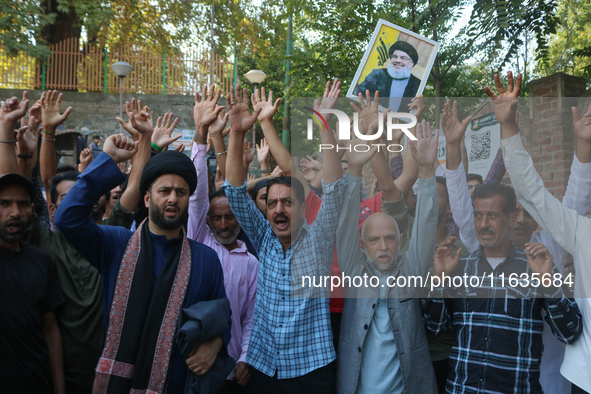 Kashmiri Shia Muslims shout slogans during a protest against Israel following the killing of Lebanon's Hezbollah leader Sayyed Hassan Nasral...