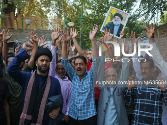 Kashmiri Shia Muslims shout slogans during a protest against Israel following the killing of Lebanon's Hezbollah leader Sayyed Hassan Nasral...