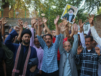 Kashmiri Shia Muslims shout slogans during a protest against Israel following the killing of Lebanon's Hezbollah leader Sayyed Hassan Nasral...